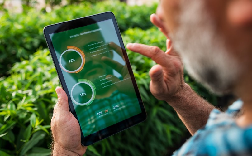 A man analyzing his business on a tablet