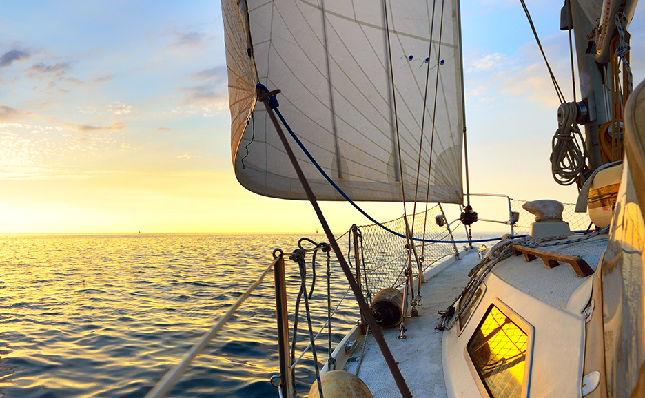 A view from the deck of a yacht sailing in calm waters