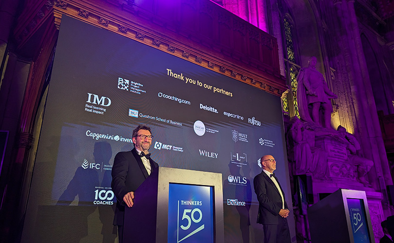 Des Dearlove and Stuart Crainer, founders of Thinkers50, speak on stage at the event.