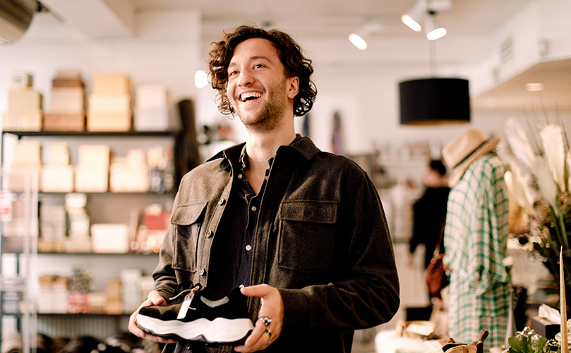 A man who buys shoes at a retail store