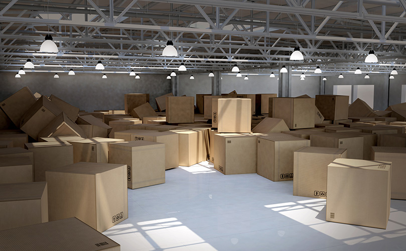 Cardboard boxes are scattered in the warehouse