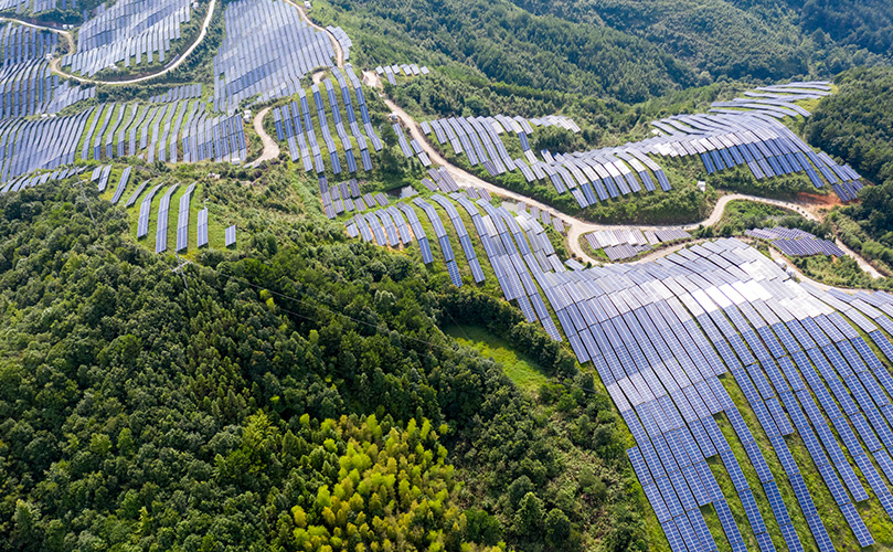 Bird's eye view of the mountain's solar power plant and forest