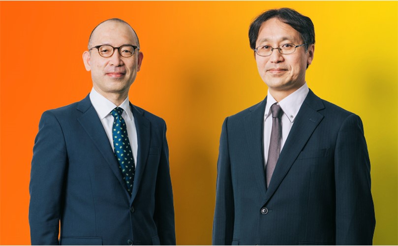 Dr. Issei Imoto. Dr Masuro Fuji with a yellow and orange gradient background